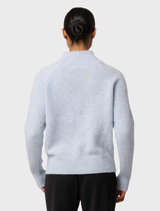 A close-up of the Blue Frost Savanna Alpaca Blend Sweater, highlighting its cozy fabric and stylish knit pattern.