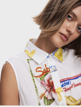 A white dress embellished with an eye-catching, colorful print.