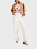 Casual outfit showcasing an Off-White T-shirt and trendy sneakers, emphasizing modern streetwear style.