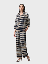 Stylish midnight blue top adorned with multi-colored patterns, ideal for casual or semi-formal wear.