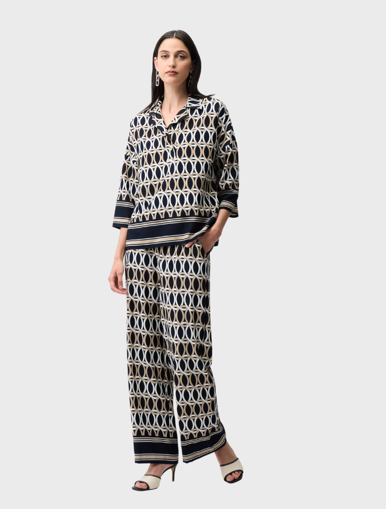 Stylish midnight blue top adorned with multi-colored patterns, ideal for casual or semi-formal wear.