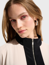 Elegant top with a moonstone and black color scheme, perfect for versatile fashion choices.