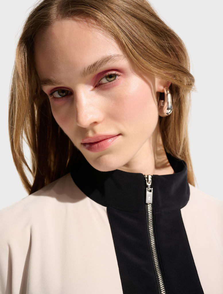 Elegant top with a moonstone and black color scheme, perfect for versatile fashion choices.