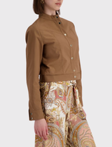 Contemporary mocca trench jacket, featuring a cropped cut, stand-up collar, and stylishly detailed sleeve hems for a refined look.