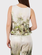 Stylish olive top with an all-over tropical print, satin finish, round neckline, tank sleeves, and elastic hem for summer wear.
