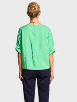 A stylish green top with short sleeves, perfect for everyday wear in warm climates.