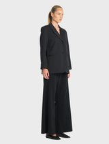 Contemporary black utility blazer offering a blend of fashion and function, perfect for everyday wear.