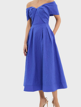 A blue dress highlighted by a ruffled neckline, presenting a fashionable and graceful appearance.

