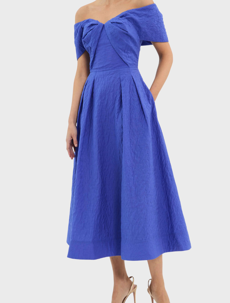 A blue dress highlighted by a ruffled neckline, presenting a fashionable and graceful appearance.

