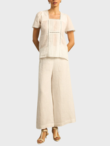 Yonder Top displayed in Floss, highlighting its elegant style and versatile wearability.