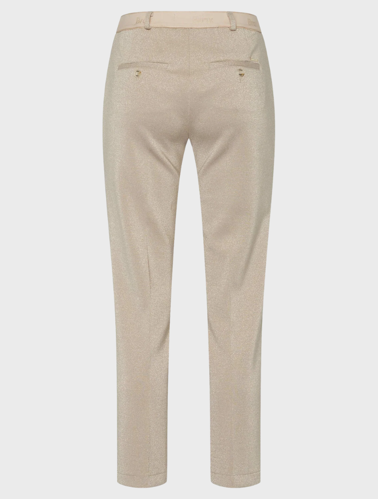 Women's beige pants crafted from lightweight fabric, perfect for comfort and style in any casual setting.