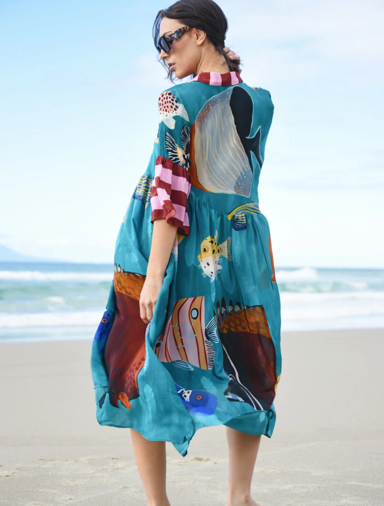 Stylish dress showcasing a lively multi-fish design, suitable for summer parties or beach vacations.