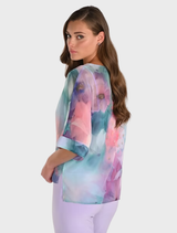 Aqua and lilac woven top, designed for a relaxed fit, ideal for layering or wearing alone in casual settings.
