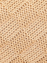 Hanging on a hook, the beige woven clutch bag Lois Woven Frame Bag - Natural is showcased.