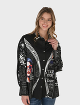 A black and multi-colored woven blouse displayed on a hanger, showcasing its intricate patterns and textures.