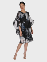 Black and grey woven dress by Frank Lyman, featuring chiffon fabric, A-line shape, and elegant cape sleeves.
