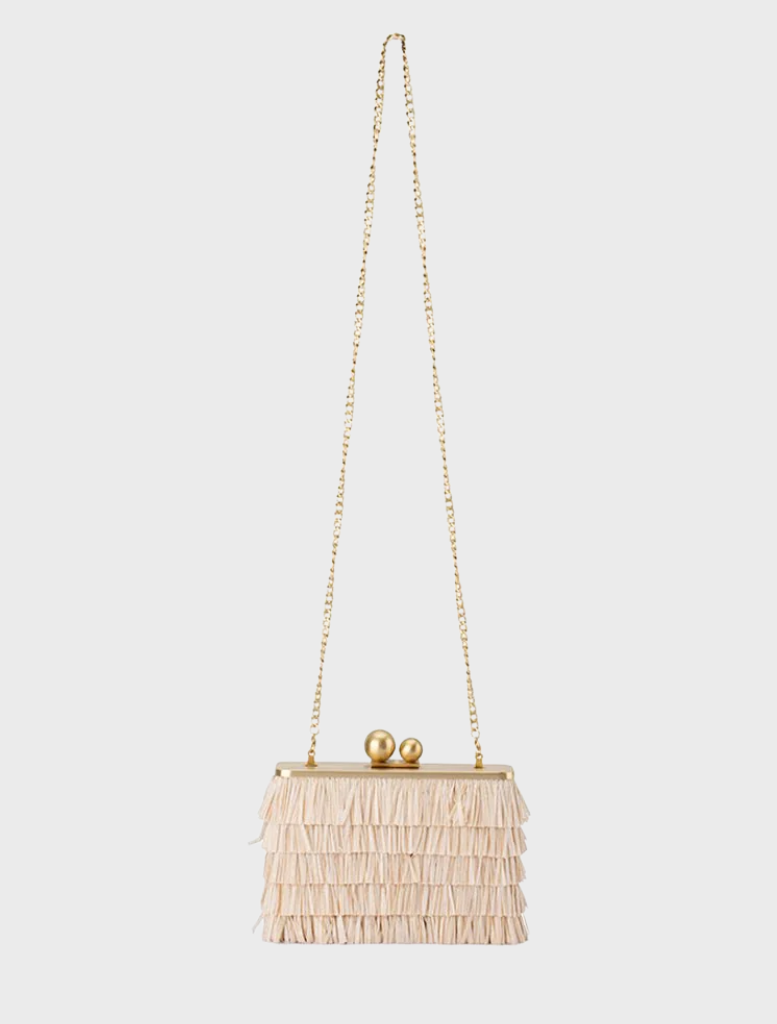 A natural-colored Carlita Fringe Clutch made of white fringe, offering a trendy and unique accessory for various occasions.