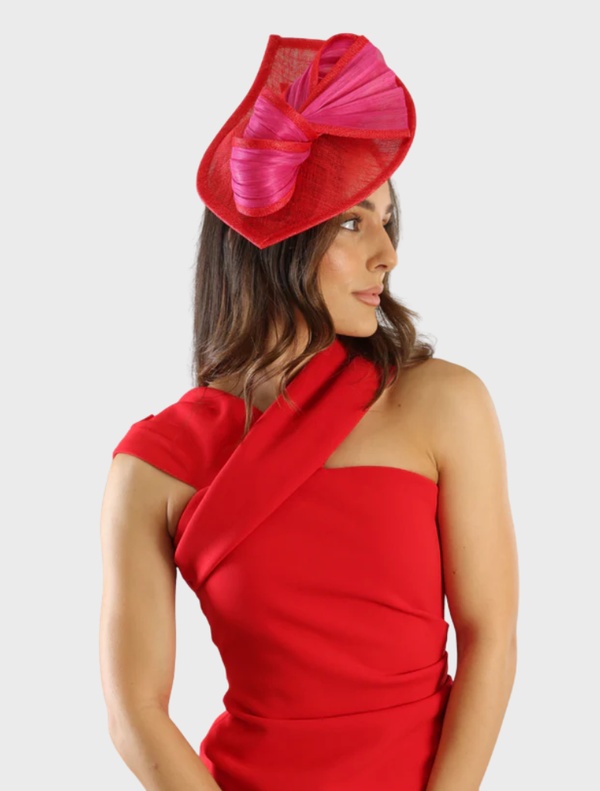 Elegant red and pink fascinator with floral accents, perfect for formal events or special occasions.
