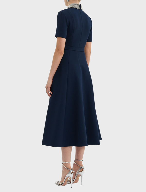 Stylish navy midi dress with short sleeves, ideal for warm weather and suitable for various events and outings.
