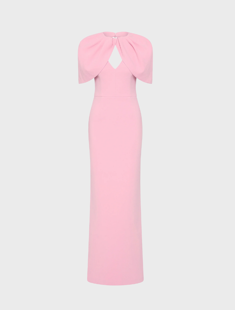 Light pink Xena gown displayed on a mannequin, featuring elegant draping and a flowing silhouette.
