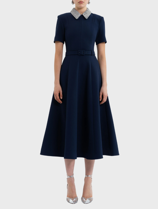 Elegant navy midi dress with short sleeves, designed with a flattering silhouette for versatile styling options.