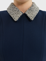 Stylish navy midi dress with short sleeves, ideal for warm weather and suitable for various events and outings.