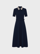Navy Xena short sleeve midi dress featuring a fitted bodice and flowing skirt, perfect for casual or semi-formal occasions.