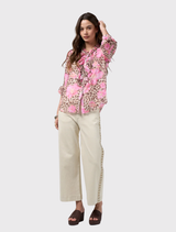 Yala Blouse in multi print combines leopard and floral designs, with ruffle details, button front, and elastic cuffs, includes cami.