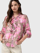 Multi-patterned Yala Blouse featuring leopard and floral prints, ruffle trim, button front, and elasticated cuffs with a cami.
