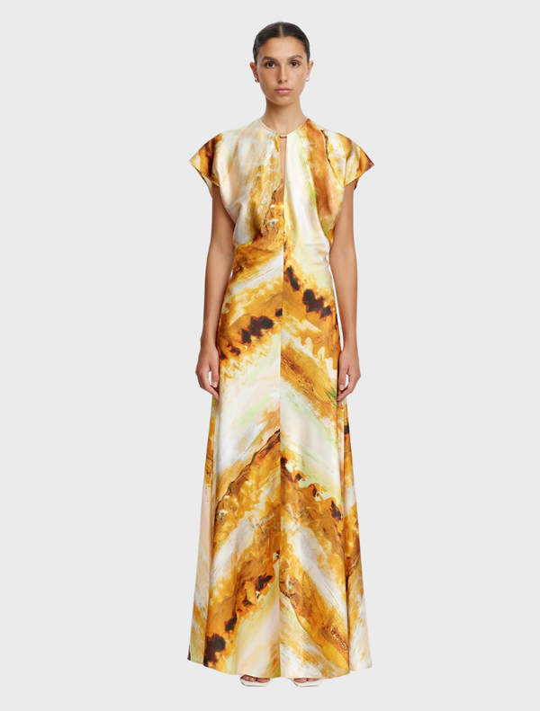 Yarrow Maxi Dress in Opal Abstract features a flowing design with an abstract pattern in soft, muted colors.

