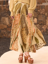 A vibrant yellow skirt featuring a stylish cut, ideal for warm weather outfits.