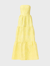 A stunning yellow strapless gown on display, illustrating its graceful lines and vibrant hue, perfect for a formal event.