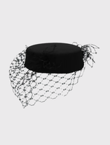 Black Zahra Pillbox Hat by Morgan & Taylor, featuring a structured design and bold veiling for a sophisticated look.
