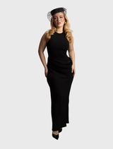 Morgan & Taylor's black Zahra Pillbox Hat, showcasing a classic shape and elegant veiling, perfect for formal events.