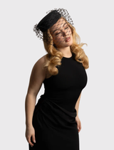 Sophisticated black pillbox hat by Morgan & Taylor, featuring a minimalist design and chic veiling for stylish events.