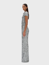 Silver Zayn gown displayed on a mannequin, showcasing its elegant design and shimmering fabric.