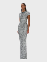 Silver Zayn gown displayed on a mannequin, featuring elegant draping and a floor-length design.