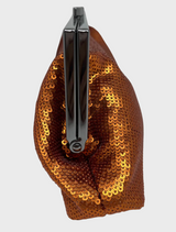 An elegant orange clutch bag with a polished metal clasp, designed for chic outings.