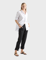Black Zip Cargo pants presented, showcasing their utility pockets and sleek design on a plain white surface.