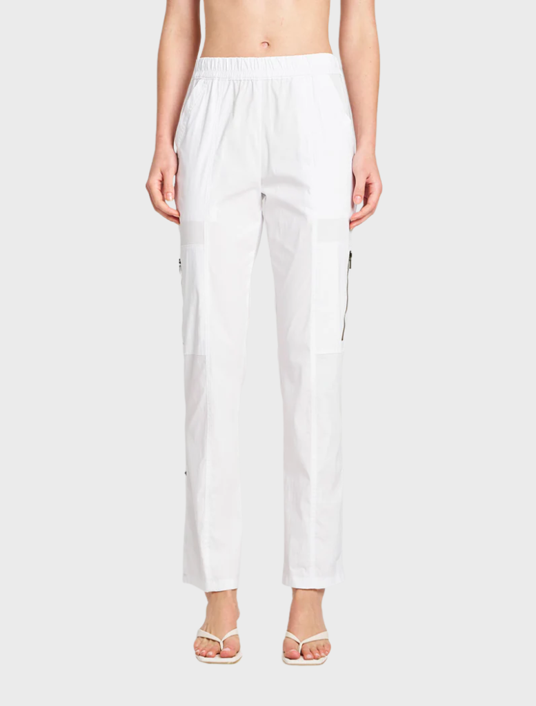 White Zip Cargo pants arranged neatly, illustrating a blend of fashion and functionality with zippered pockets.