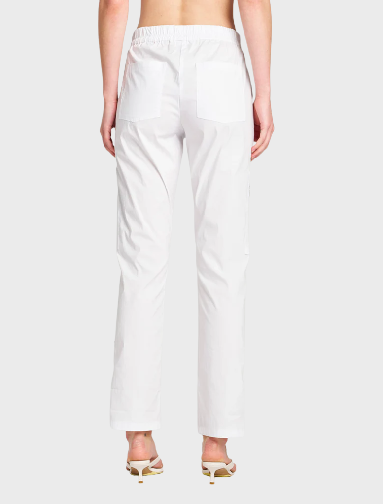 White Zip Cargo pants arranged neatly, highlighting their stylish design and practical storage options.