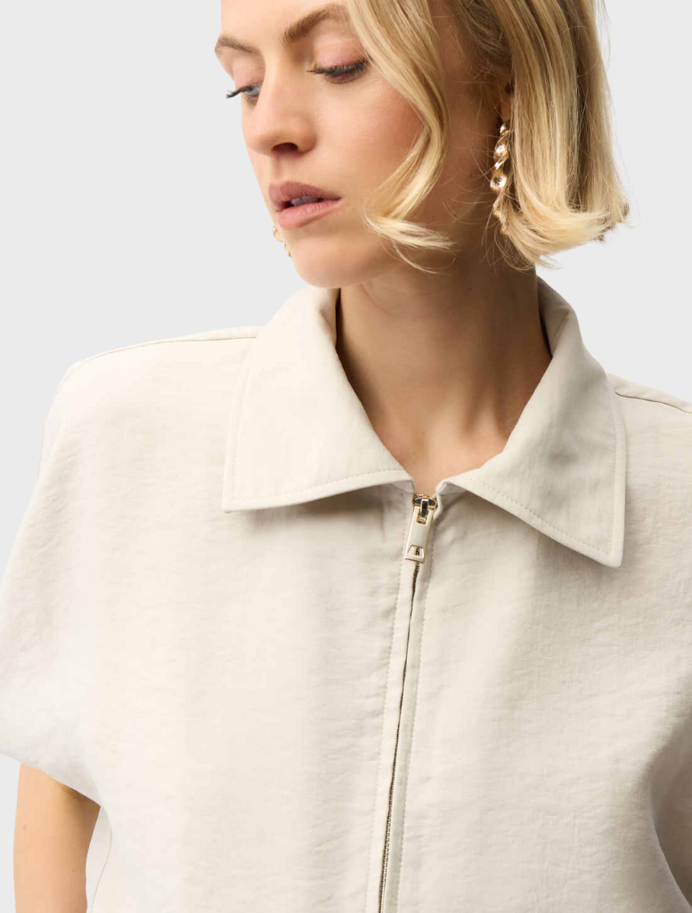 Stylish moonstone jacket with a zipper front, designed for comfort and versatility in various settings.