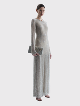 Silver Ziva Gown features a full-length column silhouette, round neckline, long sleeves, and embellished fringing on the skirt.